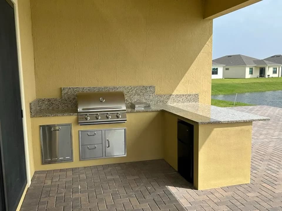 Apex kitchen with a light warm-colored stucco exterior