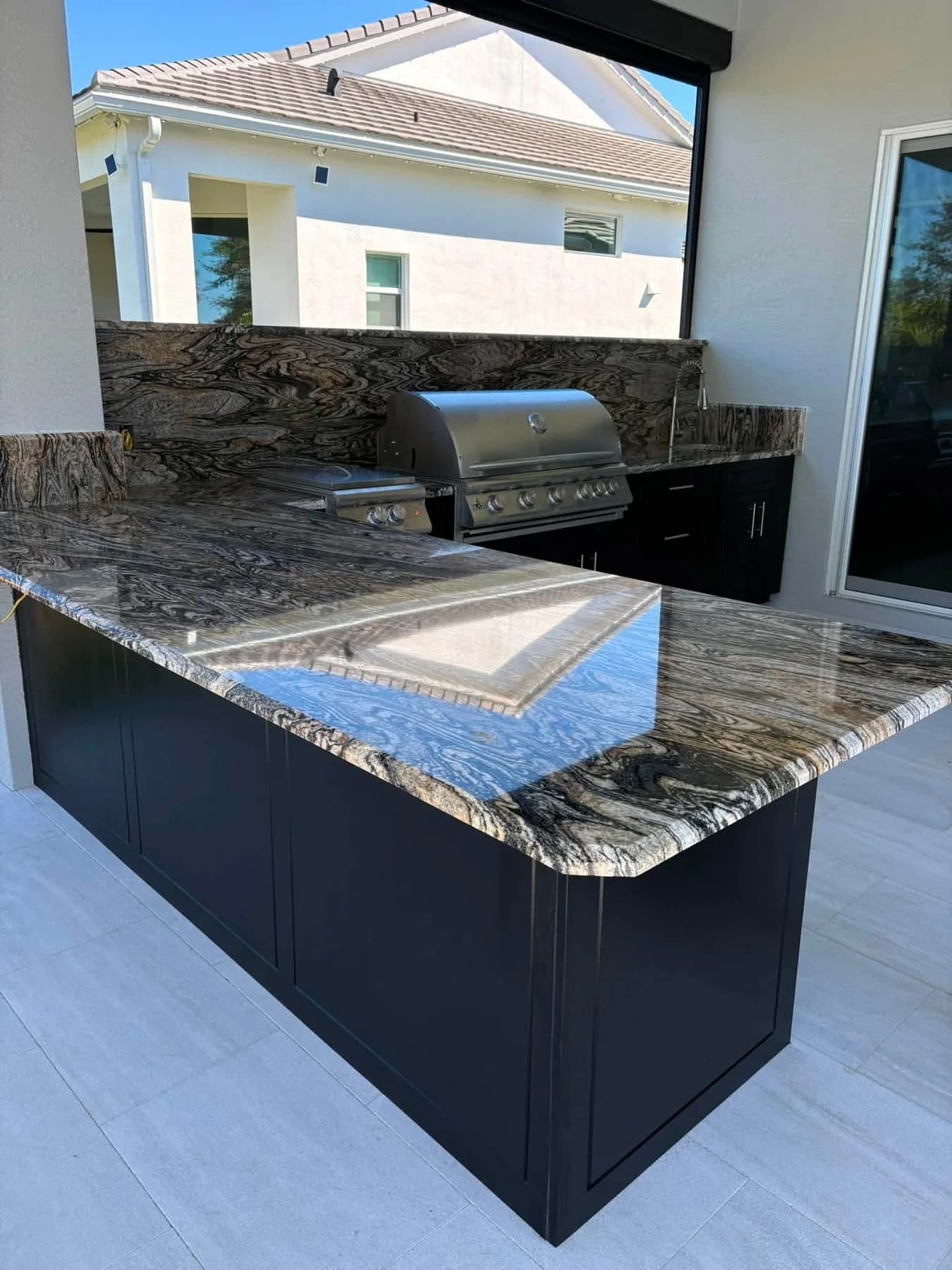 Apex kitchen countertop showing natural stone pattern and an extended serving surface